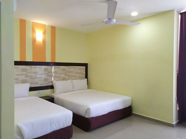 Imagen de la habitación del Hotel Sun Inns Meru Raya. Foto 19