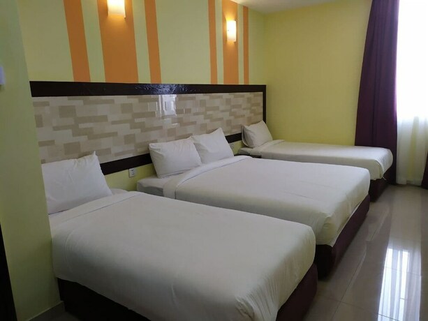 Imagen de la habitación del Hotel Sun Inns Meru Raya. Foto 20