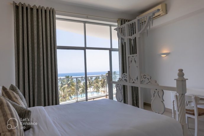 Imagen de la habitación del Hotel Sun N Sand Beach Resort. Foto 8