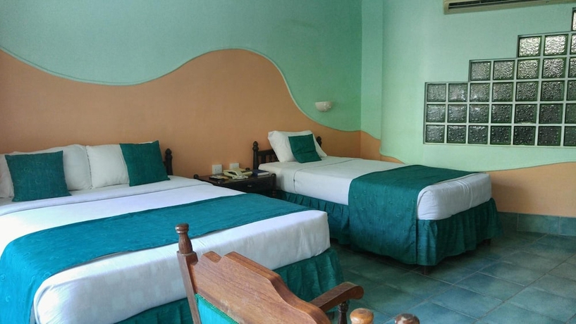 Imagen de la habitación del Hotel Sun N Sand Beach Resort. Foto 12