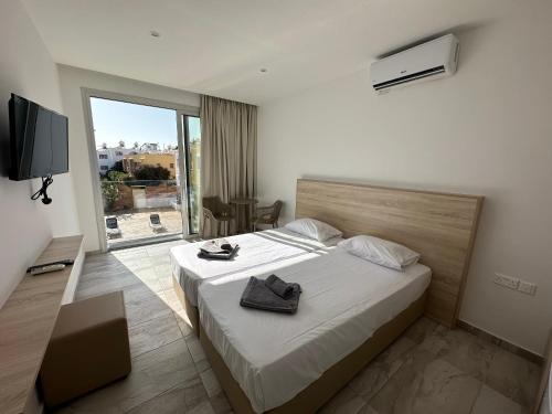 Imagen de la habitación del Hotel Sun Plaza Suites - Adults Only. Foto 5