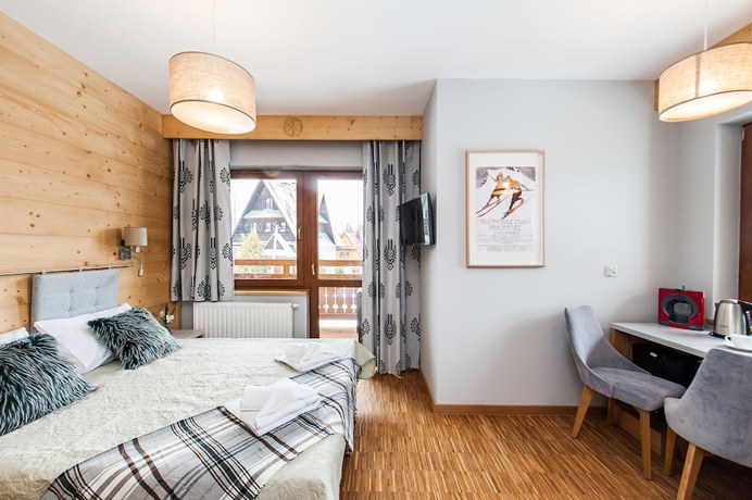 Imagen de la habitación del Hotel Sun and Snow Resorts Lipki Park. Foto 2