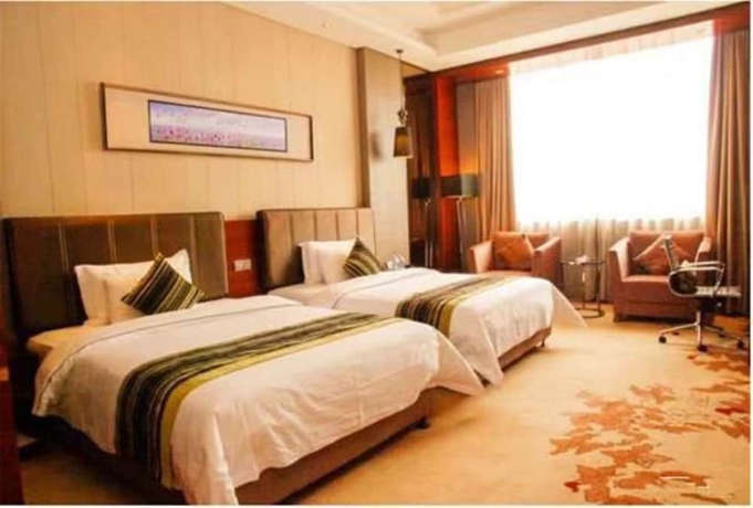Imagen de la habitación del Hotel Sunbelieve International Hotel. Foto 3