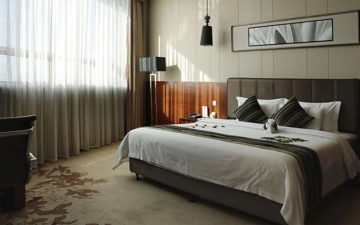 Imagen de la habitación del Hotel Sunbelieve International Hotel. Foto 10