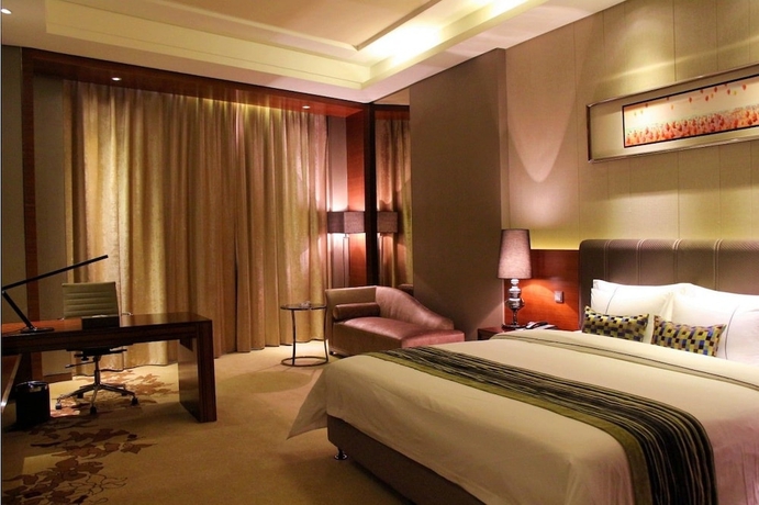 Imagen de la habitación del Hotel Sunbelieve International Hotel. Foto 15