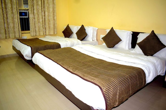 Imagen de la habitación del Hotel Suncity Cottage. Foto 14