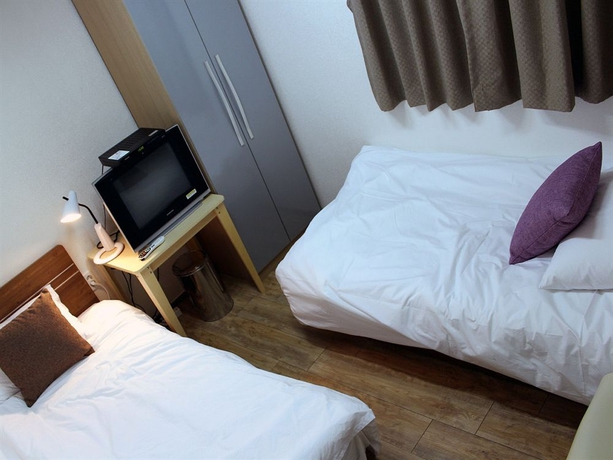 Imagen de la habitación del Hotel Suncity Guest House. Foto 7