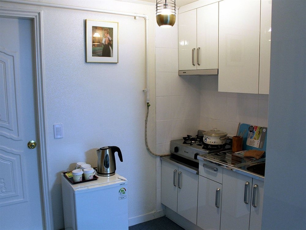 Imagen de la habitación del Hotel Suncity Guest House. Foto 13