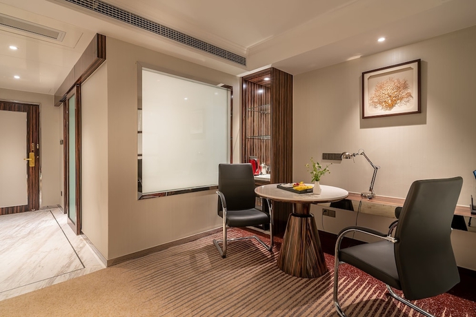 Imagen de la habitación del Hotel Suning Universal Hotel. Foto 3