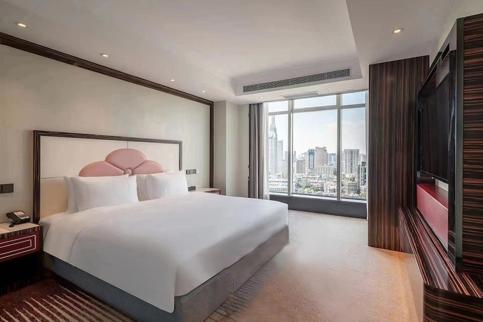 Imagen de la habitación del Hotel Suning Universal Hotel. Foto 4
