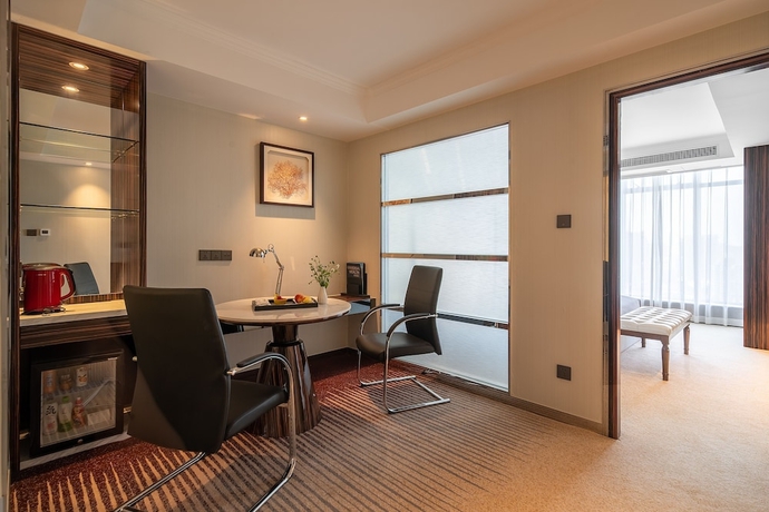 Imagen de la habitación del Hotel Suning Universal Hotel. Foto 5