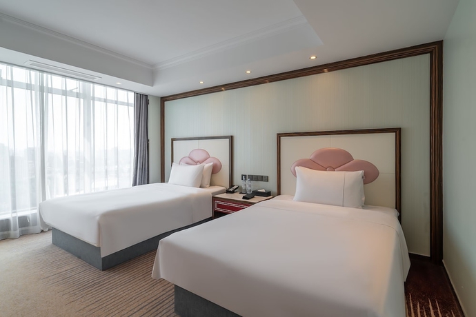 Imagen de la habitación del Hotel Suning Universal Hotel. Foto 6