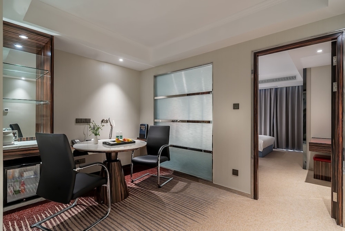 Imagen de la habitación del Hotel Suning Universal Hotel. Foto 10