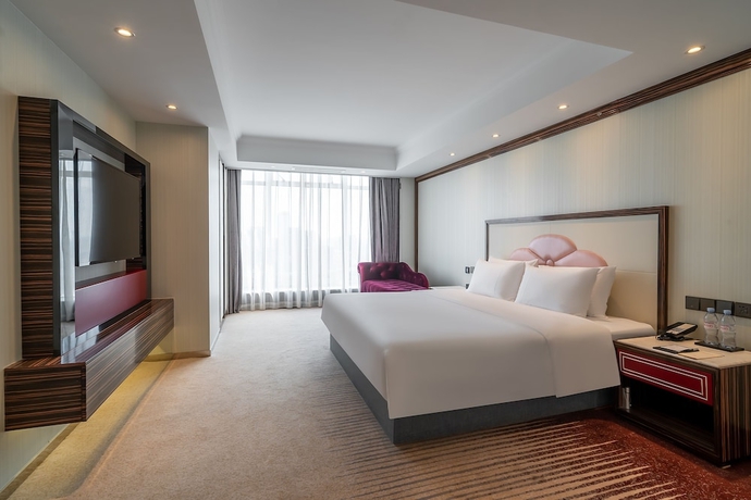Imagen de la habitación del Hotel Suning Universal Hotel. Foto 12
