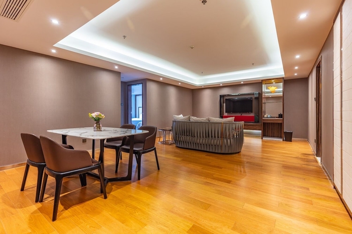 Imagen de la habitación del Hotel Suning Universal Hotel. Foto 15