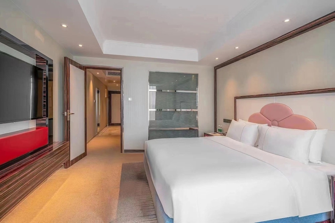 Imagen de la habitación del Hotel Suning Universal Hotel. Foto 16