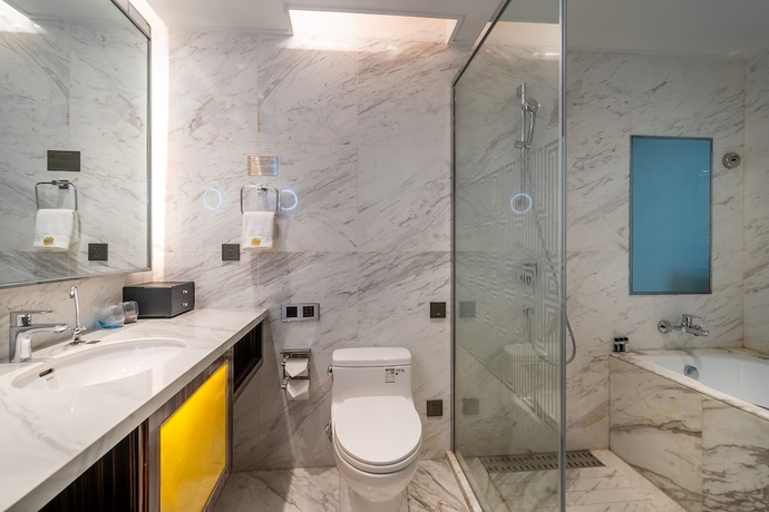 Imagen de la habitación del Hotel Suning Universal Hotel. Foto 17