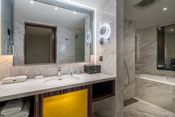 Imagen de la habitación del Hotel Suning Universal Hotel. Foto 18