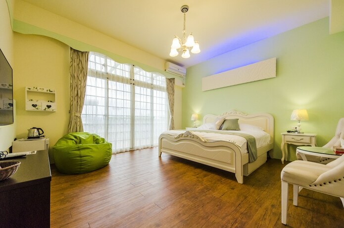 Imagen de la habitación del Hotel Sunny Breeze Garden. Foto 12