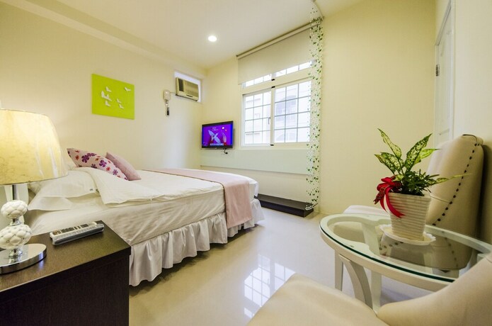 Imagen de la habitación del Hotel Sunny Breeze Garden. Foto 14
