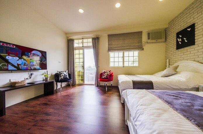 Imagen de la habitación del Hotel Sunny Breeze Garden. Foto 20
