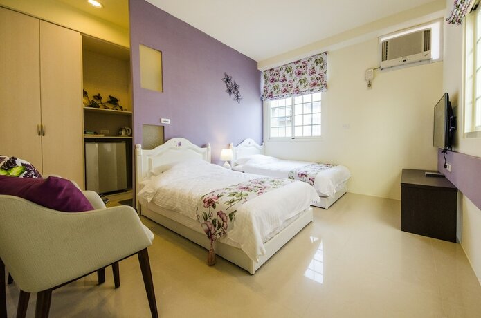 Imagen de la habitación del Hotel Sunny Breeze Garden. Foto 22