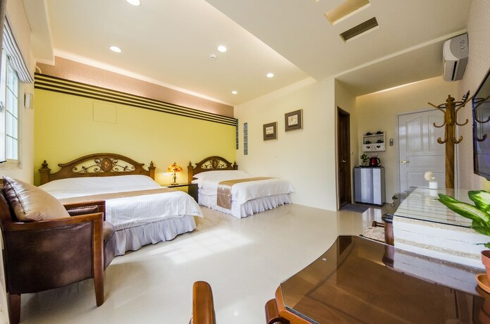 Imagen de la habitación del Hotel Sunny Breeze Garden. Foto 26