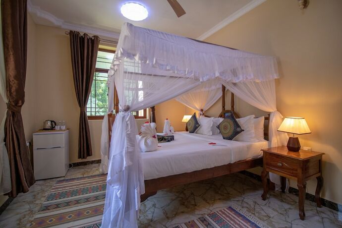Imagen de la habitación del Hotel Sunny Palms Beach Bungalows. Foto 13