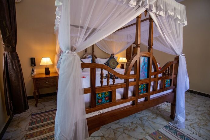 Imagen de la habitación del Hotel Sunny Palms Beach Bungalows. Foto 15