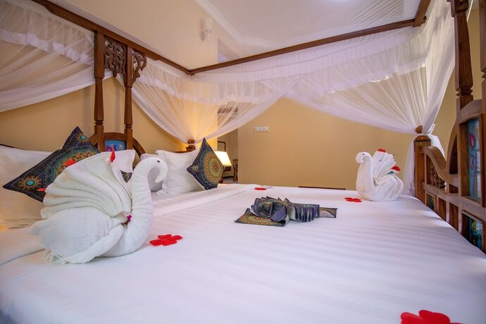 Imagen de la habitación del Hotel Sunny Palms Beach Bungalows. Foto 18