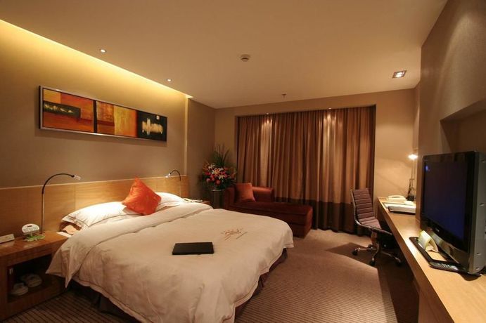 Imagen de la habitación del Hotel Sunny Resort - Dandong. Foto 6