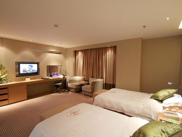 Imagen de la habitación del Hotel Sunny Resort - Dandong. Foto 9