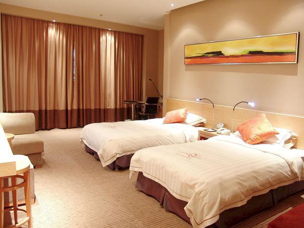 Imagen de la habitación del Hotel Sunny Resort - Dandong. Foto 14