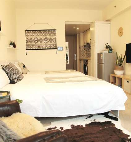 Imagen de la habitación del Hotel Sunnyrain Apartment. Foto 8