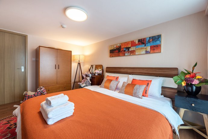 Imagen de la habitación del Hotel Sunnyrain Apartment. Foto 12