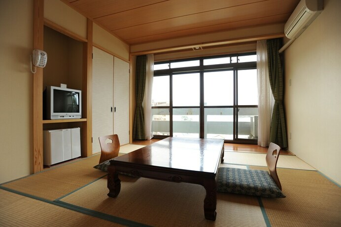 Imagen de la habitación del Hotel Sunresort Shonai. Foto 22