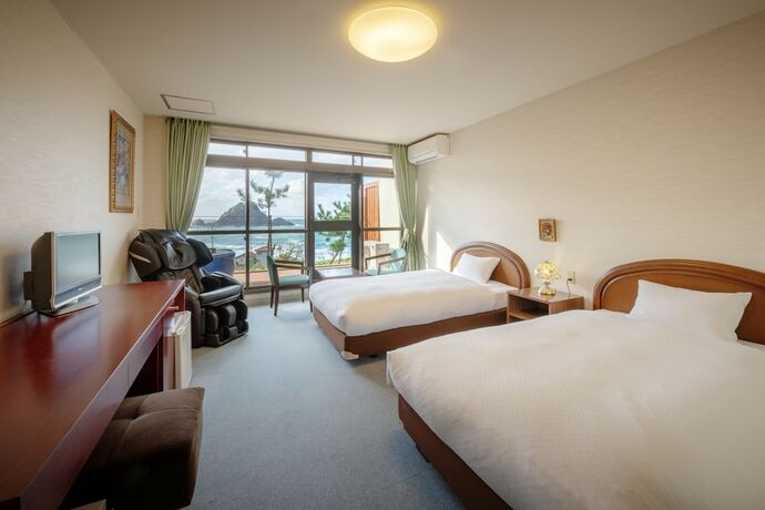 Imagen de la habitación del Hotel Sunresort Shonai. Foto 23