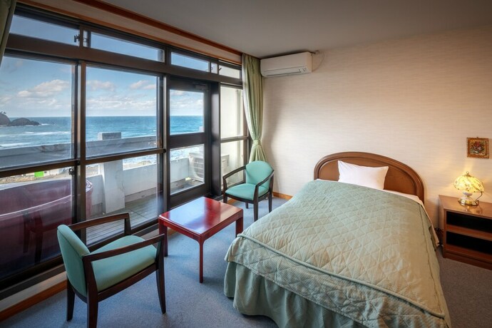 Imagen de la habitación del Hotel Sunresort Shonai. Foto 26