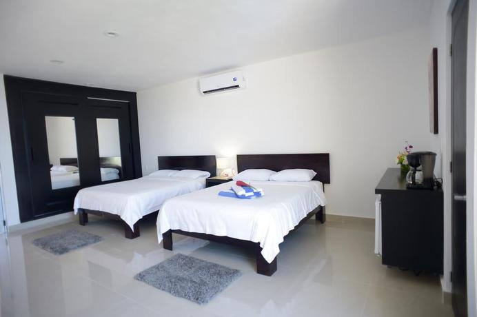 Imagen de la habitación del Hotel Sunrise 42 Suites Hotel. Foto 2