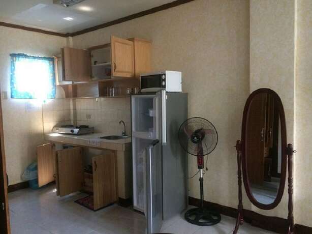 Imagen de la habitación del Hotel Sunrise Apartelle. Foto 10