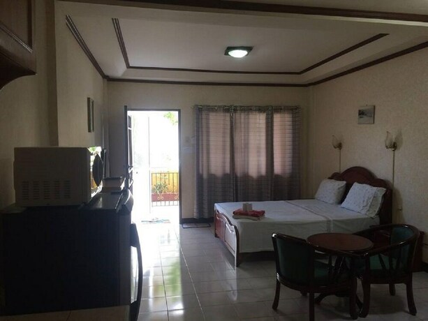 Imagen de la habitación del Hotel Sunrise Apartelle. Foto 13
