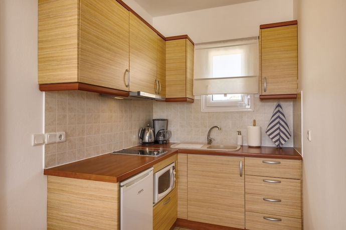 Imagen de la habitación del Hotel Sunrise Beach Suites. Foto 5