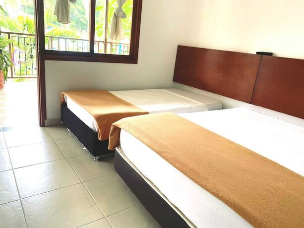 Imagen de la habitación del Hotel Sunrise Guamal. Foto 17