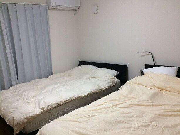 Imagen de la habitación del Hotel Sunrise Ikebukuro. Foto 18