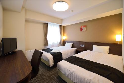 Imagen de la habitación del Hotel Sunrise Inn Iwaki. Foto 14