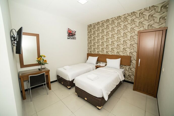 Imagen de la habitación del Hotel Sunrise Semarang. Foto 16