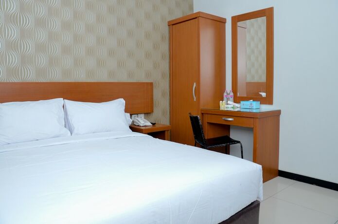 Imagen de la habitación del Hotel Sunrise Semarang. Foto 17