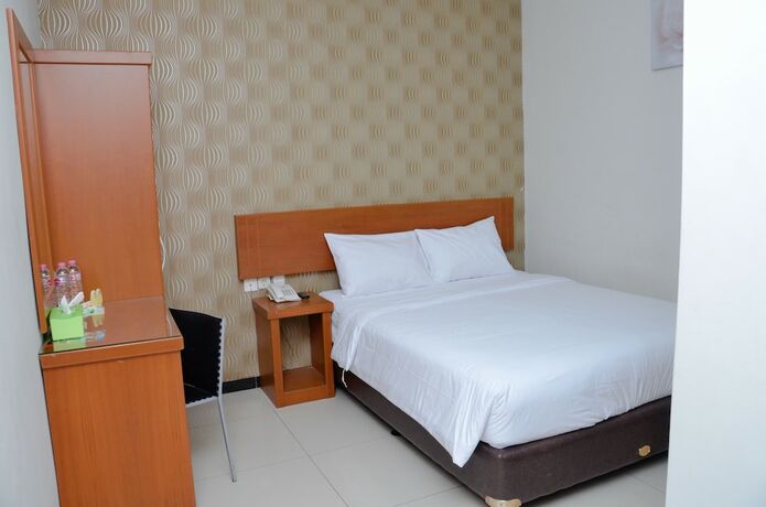 Imagen de la habitación del Hotel Sunrise Semarang. Foto 21