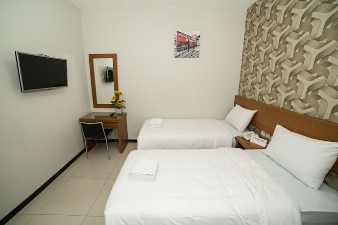Imagen de la habitación del Hotel Sunrise Semarang. Foto 22