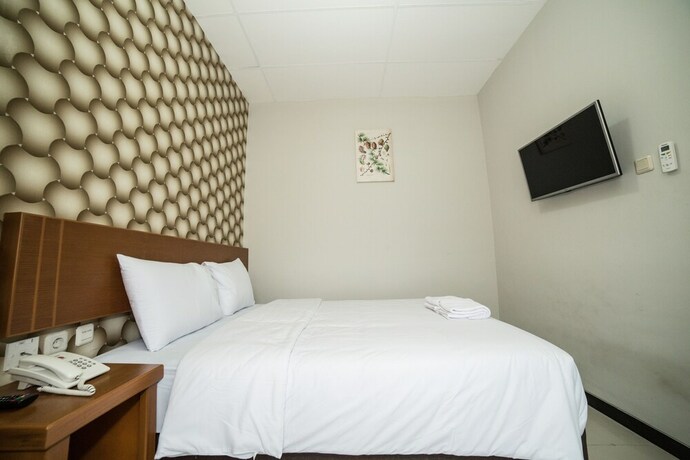 Imagen de la habitación del Hotel Sunrise Semarang. Foto 23